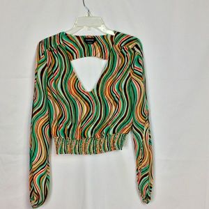 Stripped and colorful blouse with a V cut in the front and back.